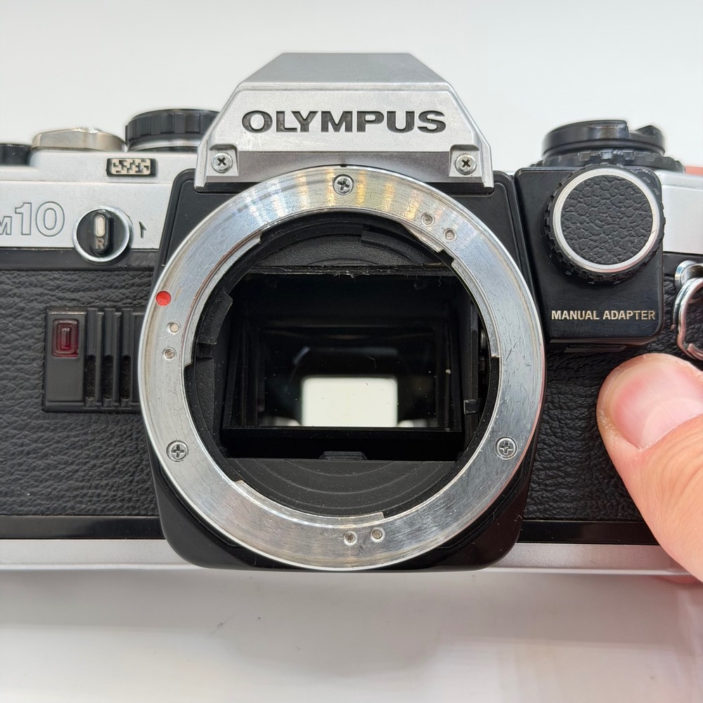 Olympus OM10 35mm Film SLR Camera Body Silver Black with Manual Adapter TESTED - Picture 2 of 12